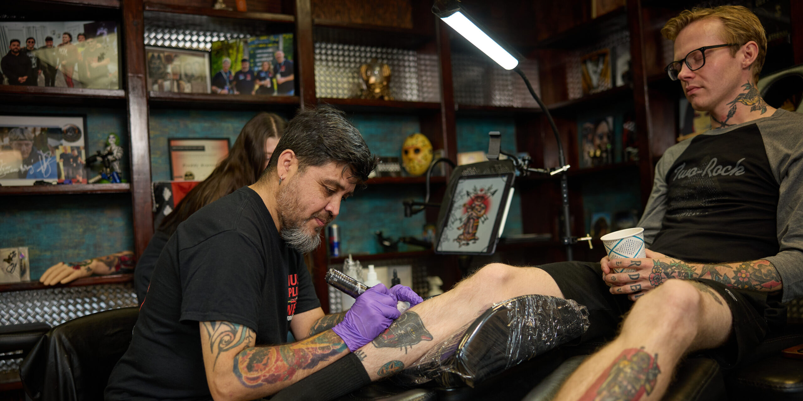 Local tattoo artist brings rock band to Peabody